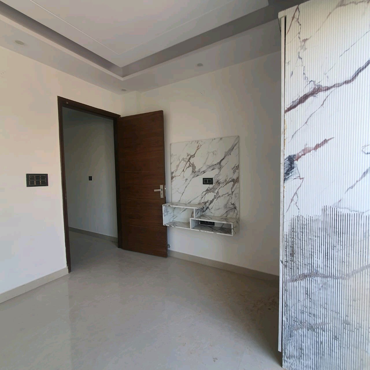 A newly constructed 2 BHK top-floor builder floor in C6B Block Janakpuri featuring 2 washrooms, a roof porta cabin, and an additional roof bathroom.