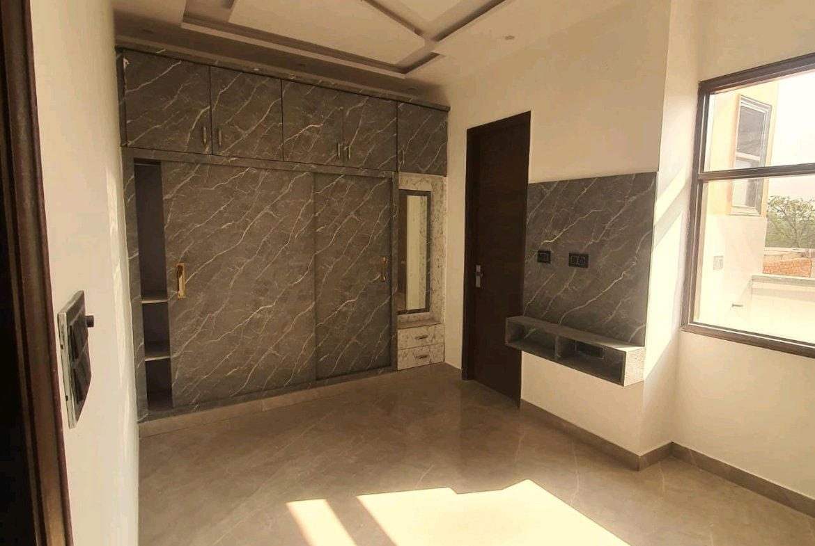 A newly constructed 2 BHK top-floor builder floor in C6B Block Janakpuri featuring 2 washrooms, a roof porta cabin, and an additional roof bathroom.