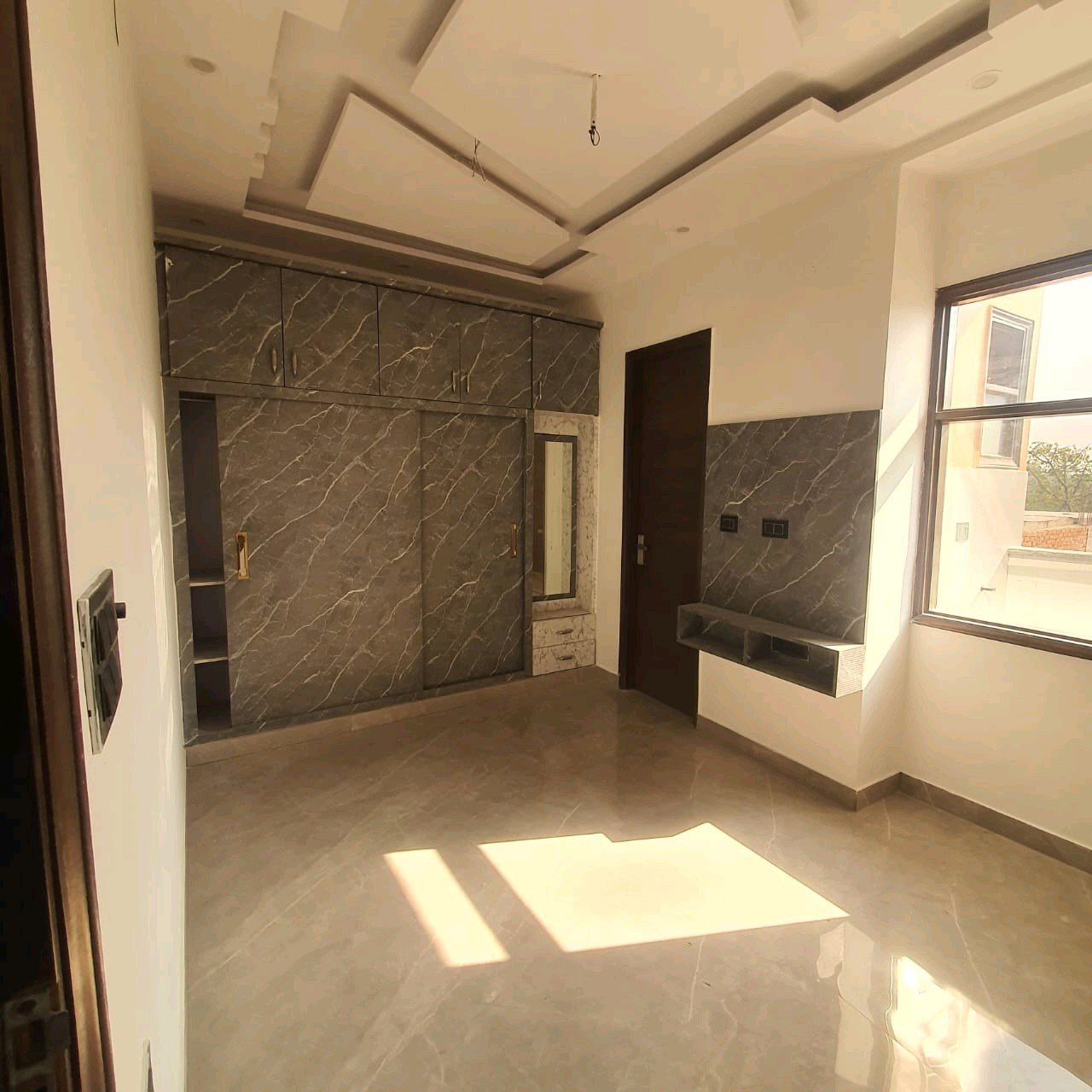 A newly constructed 2 BHK top-floor builder floor in C6B Block Janakpuri featuring 2 washrooms, a roof porta cabin, and an additional roof bathroom.