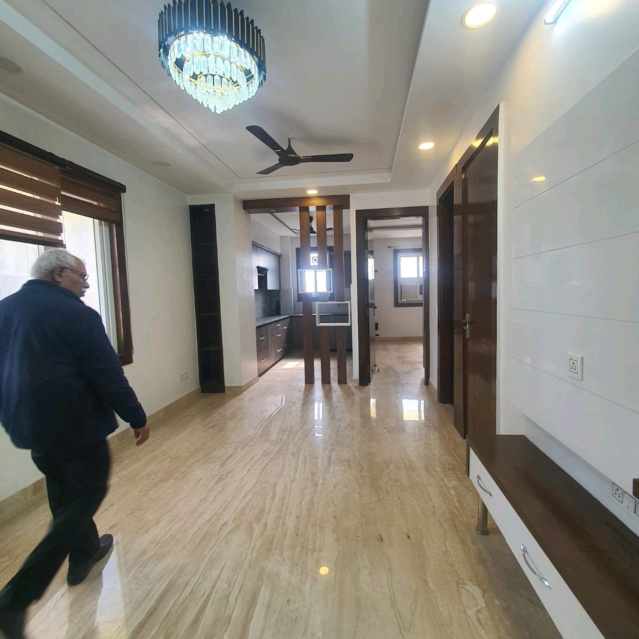 A well-designed 80 gaj top-floor builder floor in C4F Block Janakpuri with roof rights, 2 BHK + 1 room set, ACs fitted, chimney, and corner north-facing advantage.