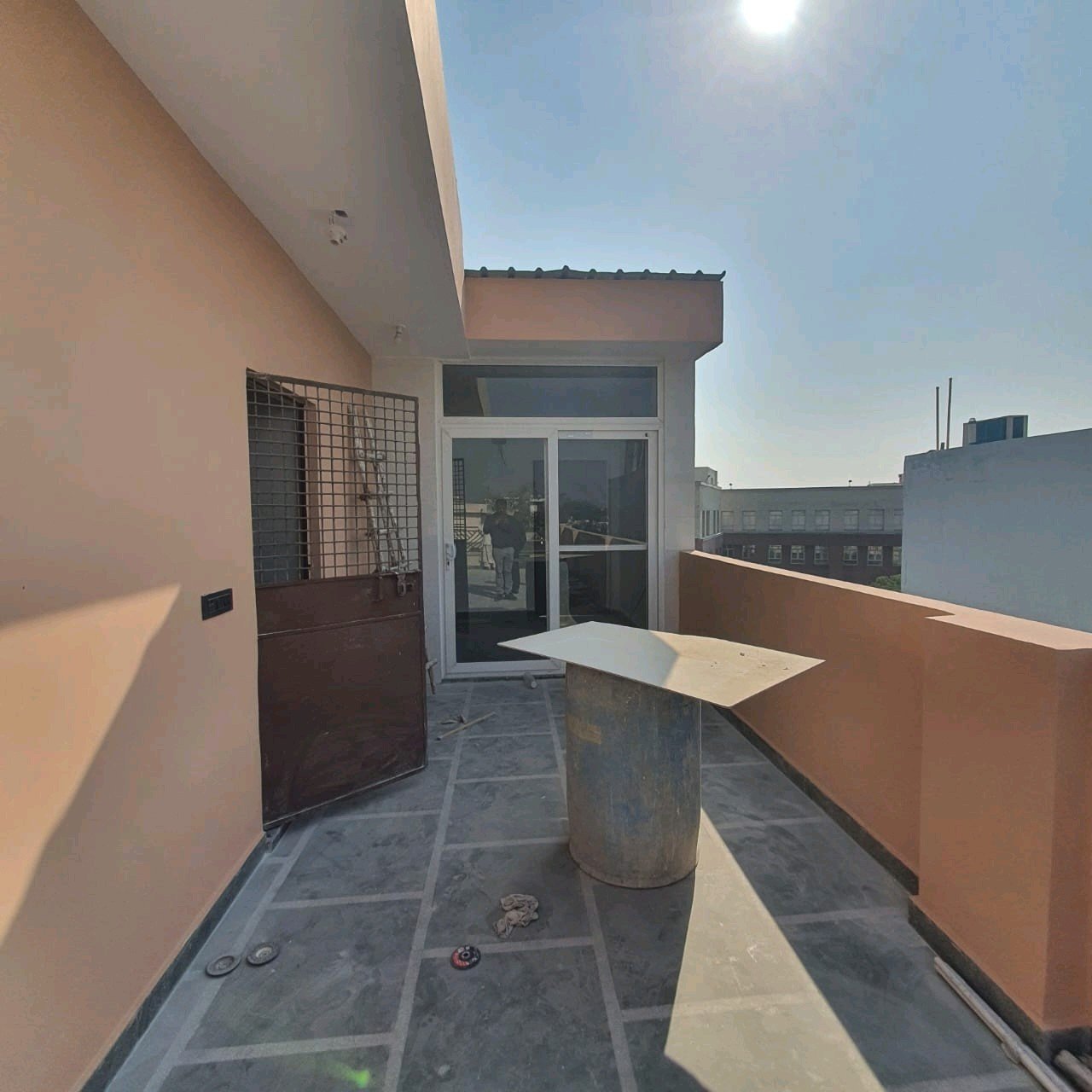 A newly constructed 2 BHK top-floor builder floor in C6B Block Janakpuri featuring 2 washrooms, a roof porta cabin, and an additional roof bathroom.