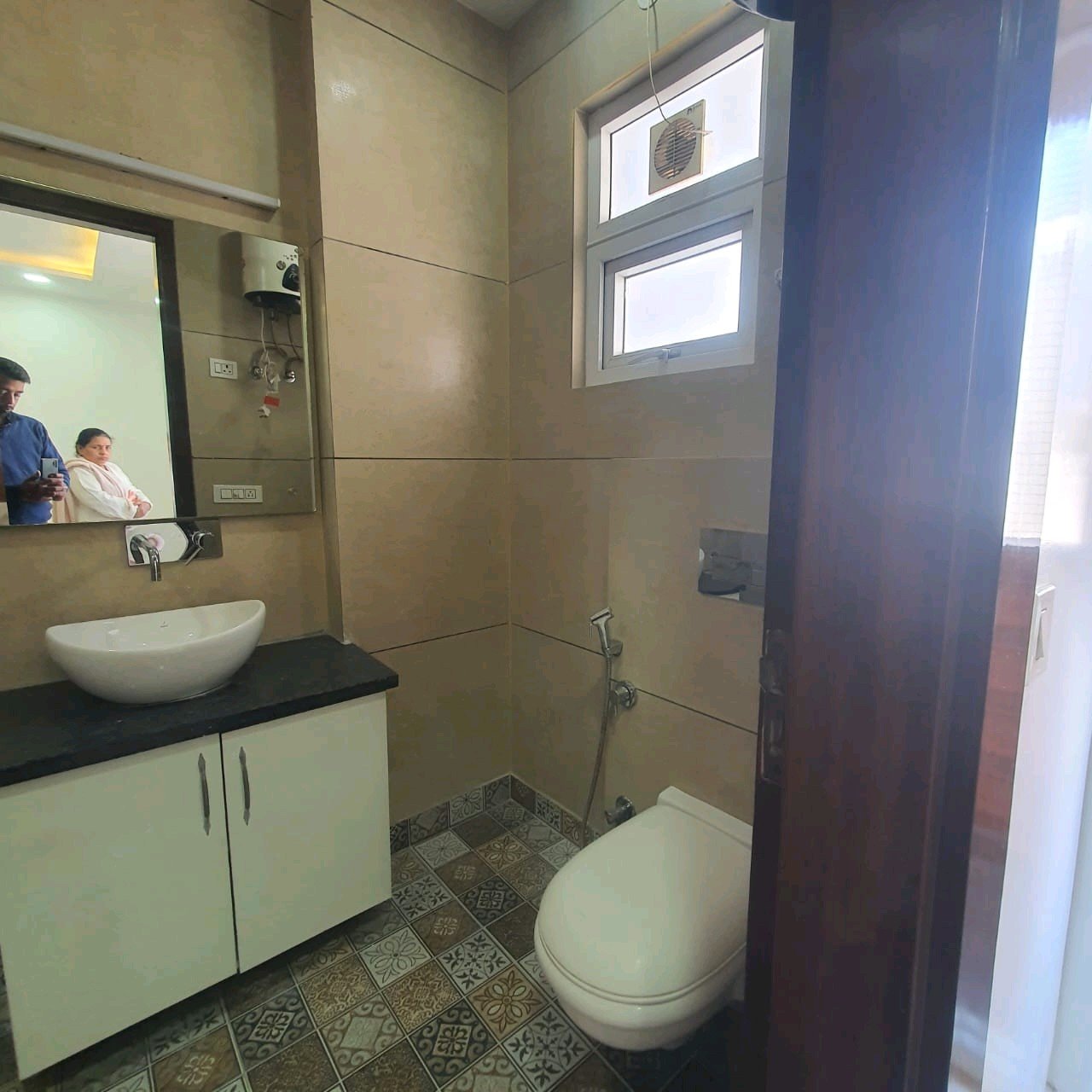 A well-designed 80 gaj top-floor builder floor in C4F Block Janakpuri with roof rights, 2 BHK + 1 room set, ACs fitted, chimney, and corner north-facing advantage.