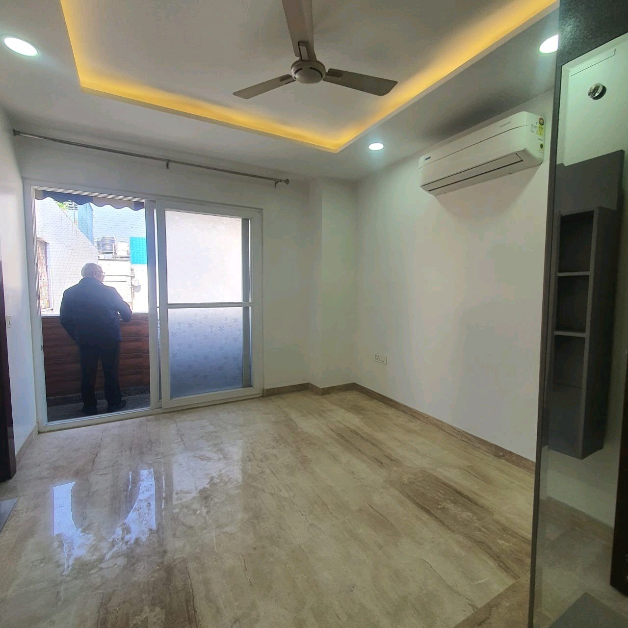 A well-designed 80 gaj top-floor builder floor in C4F Block Janakpuri with roof rights, 2 BHK + 1 room set, ACs fitted, chimney, and corner north-facing advantage.
