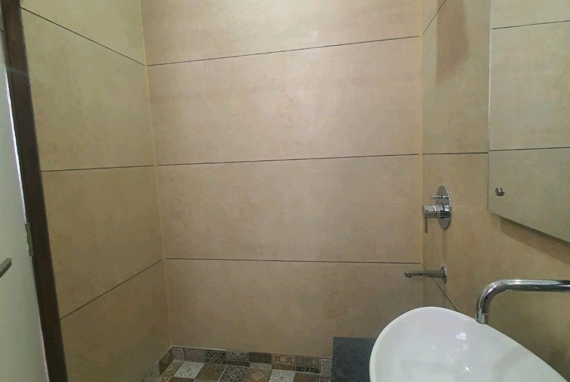 A well-designed 80 gaj top-floor builder floor in C4F Block Janakpuri with roof rights, 2 BHK + 1 room set, ACs fitted, chimney, and corner north-facing advantage.