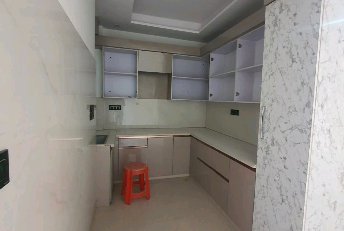 A newly constructed 2 BHK top-floor builder floor in C6B Block Janakpuri featuring 2 washrooms, a roof porta cabin, and an additional roof bathroom.