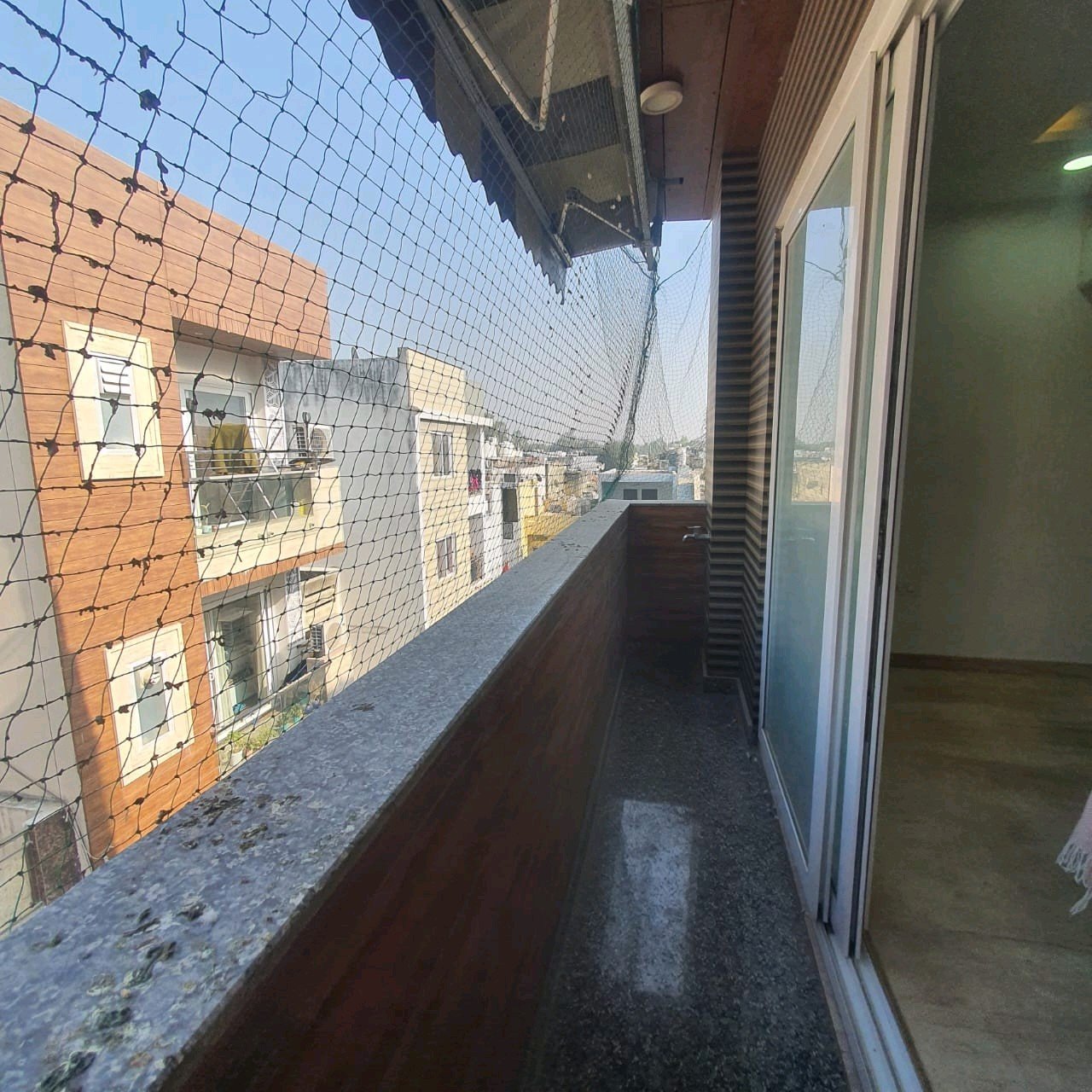 A well-designed 80 gaj top-floor builder floor in C4F Block Janakpuri with roof rights, 2 BHK + 1 room set, ACs fitted, chimney, and corner north-facing advantage.