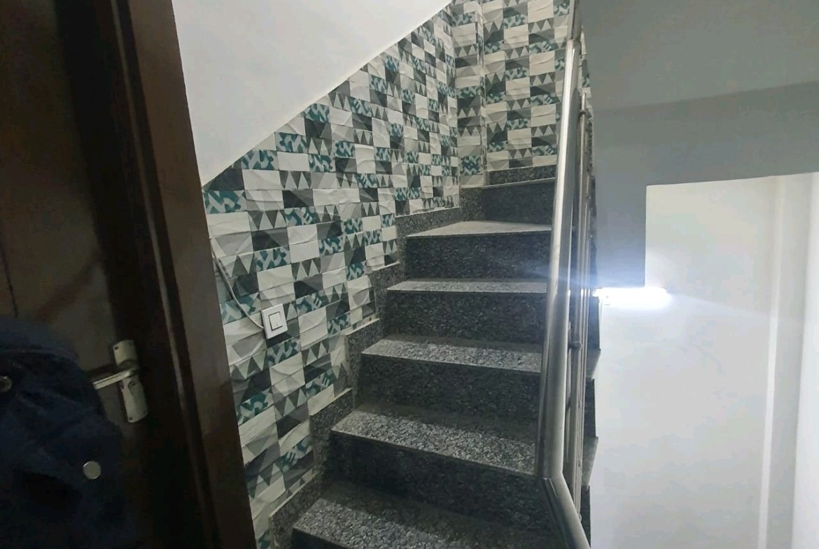 A well-designed 80 gaj top-floor builder floor in C4F Block Janakpuri with roof rights, 2 BHK + 1 room set, ACs fitted, chimney, and corner north-facing advantage.