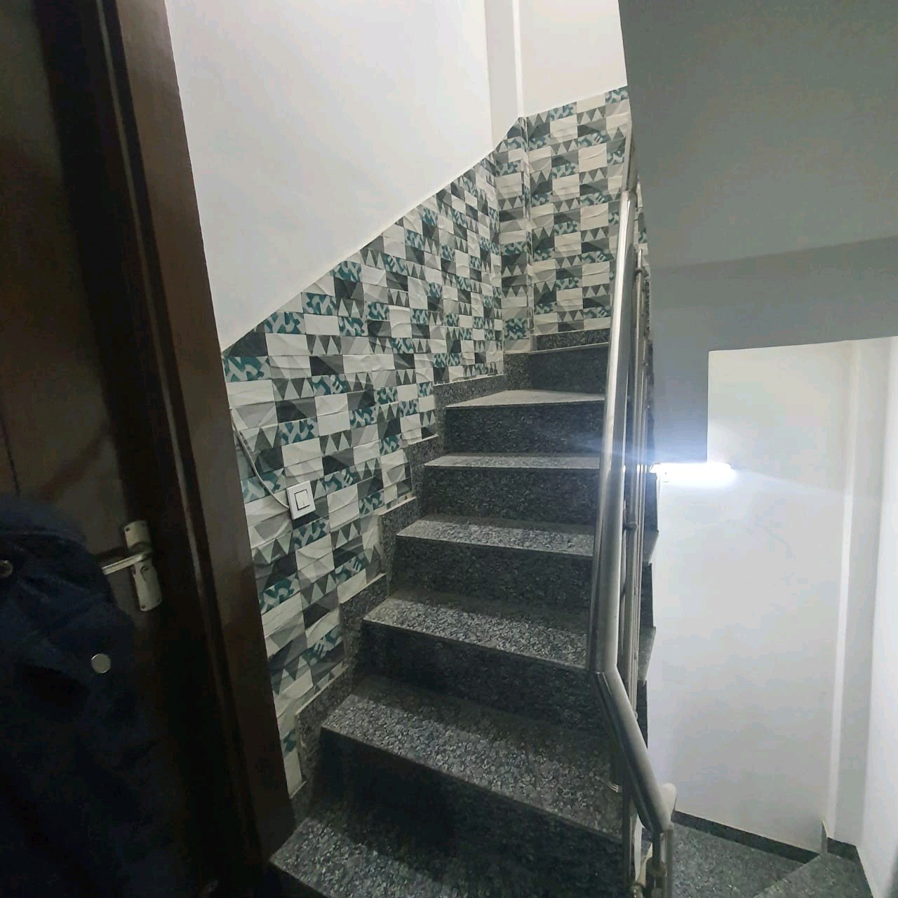 A well-designed 80 gaj top-floor builder floor in C4F Block Janakpuri with roof rights, 2 BHK + 1 room set, ACs fitted, chimney, and corner north-facing advantage.