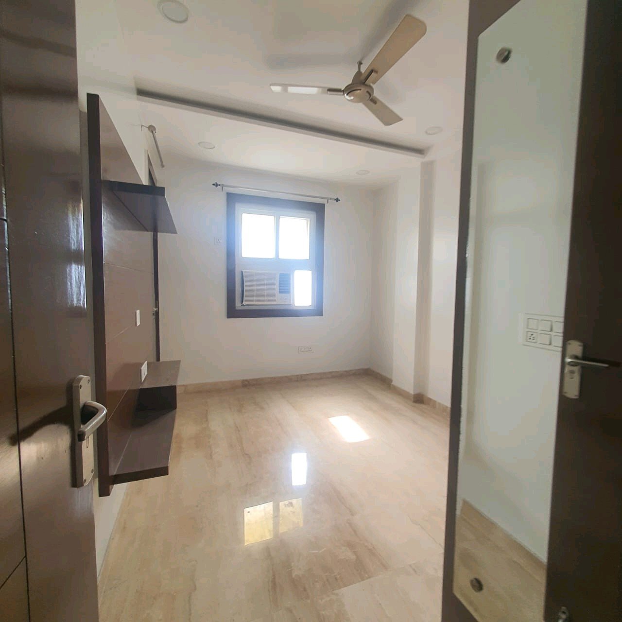 A well-designed 80 gaj top-floor builder floor in C4F Block Janakpuri with roof rights, 2 BHK + 1 room set, ACs fitted, chimney, and corner north-facing advantage.