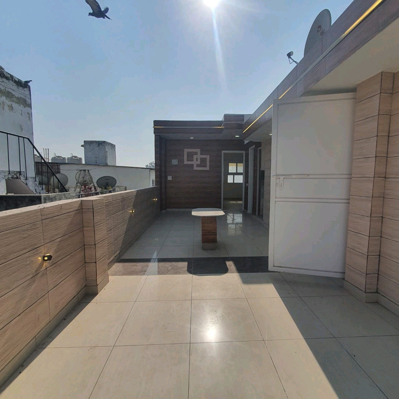 A well-designed 80 gaj top-floor builder floor in C4F Block Janakpuri with roof rights, 2 BHK + 1 room set, ACs fitted, chimney, and corner north-facing advantage.