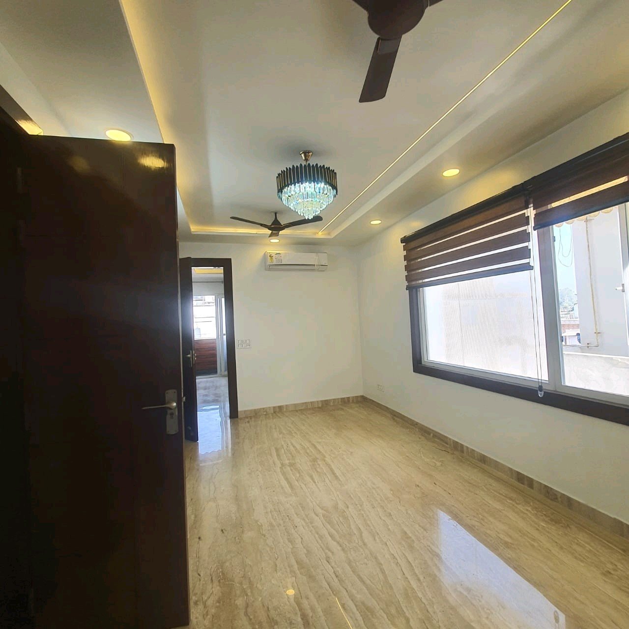 A well-designed 80 gaj top-floor builder floor in C4F Block Janakpuri with roof rights, 2 BHK + 1 room set, ACs fitted, chimney, and corner north-facing advantage.