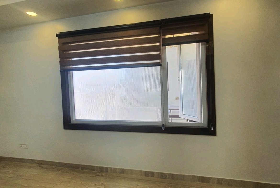 A well-designed 80 gaj top-floor builder floor in C4F Block Janakpuri with roof rights, 2 BHK + 1 room set, ACs fitted, chimney, and corner north-facing advantage.