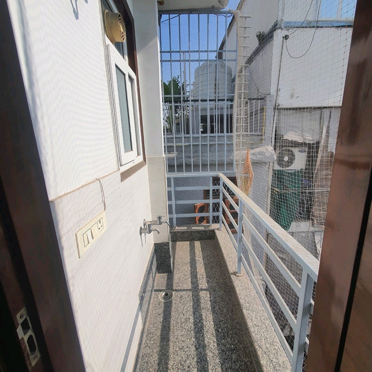 A well-designed 80 gaj top-floor builder floor in C4F Block Janakpuri with roof rights, 2 BHK + 1 room set, ACs fitted, chimney, and corner north-facing advantage.