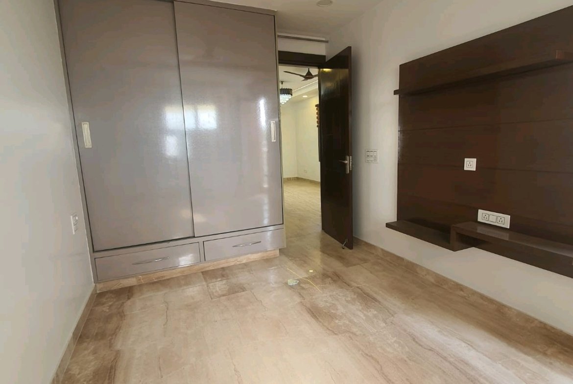 A well-designed 80 gaj top-floor builder floor in C4F Block Janakpuri with roof rights, 2 BHK + 1 room set, ACs fitted, chimney, and corner north-facing advantage.