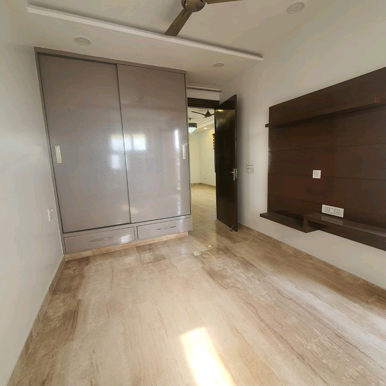 A well-designed 80 gaj top-floor builder floor in C4F Block Janakpuri with roof rights, 2 BHK + 1 room set, ACs fitted, chimney, and corner north-facing advantage.