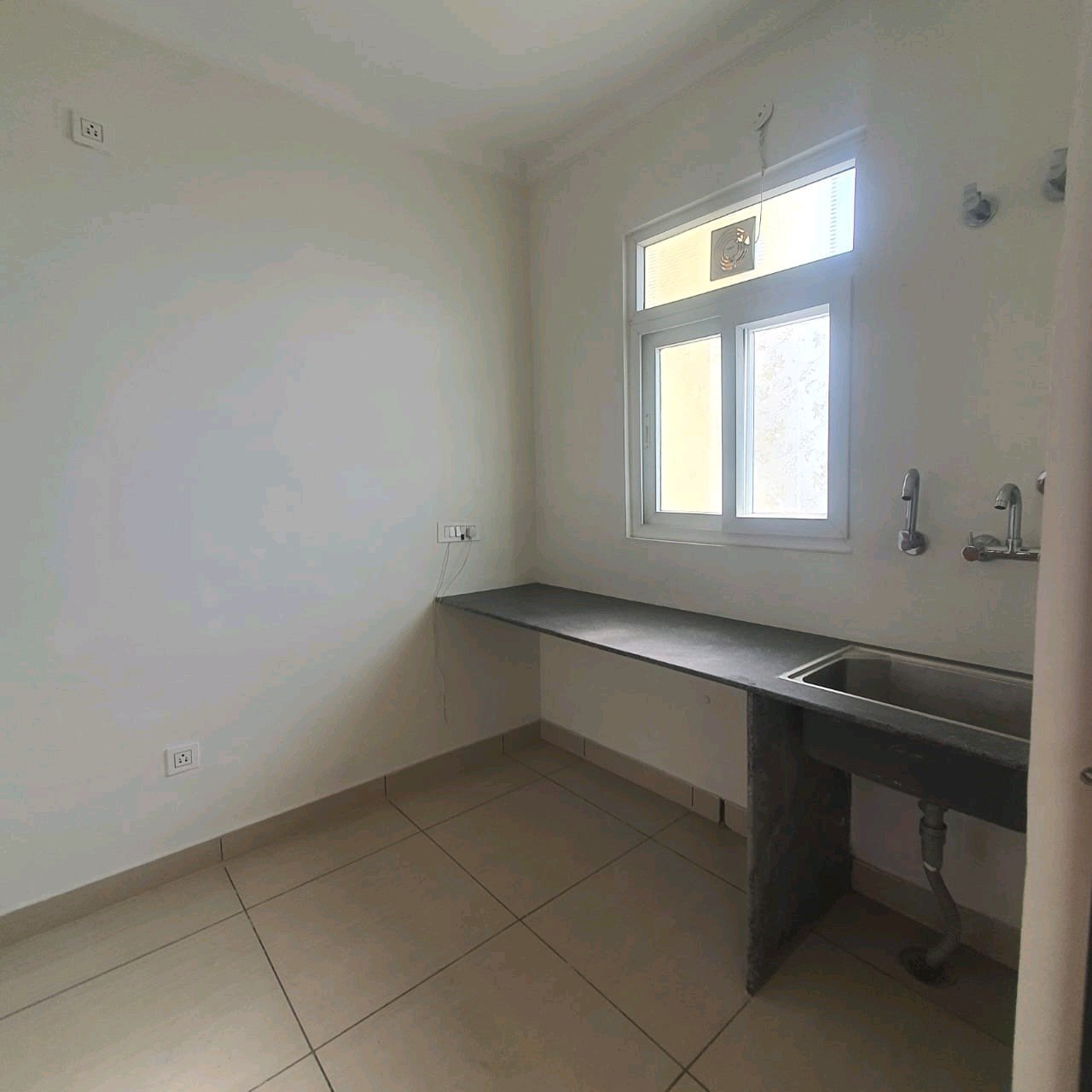 A well-designed 80 gaj top-floor builder floor in C4F Block Janakpuri with roof rights, 2 BHK + 1 room set, ACs fitted, chimney, and corner north-facing advantage.