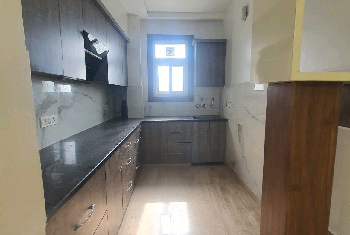 A well-designed 80 gaj top-floor builder floor in C4F Block Janakpuri with roof rights, 2 BHK + 1 room set, ACs fitted, chimney, and corner north-facing advantage.