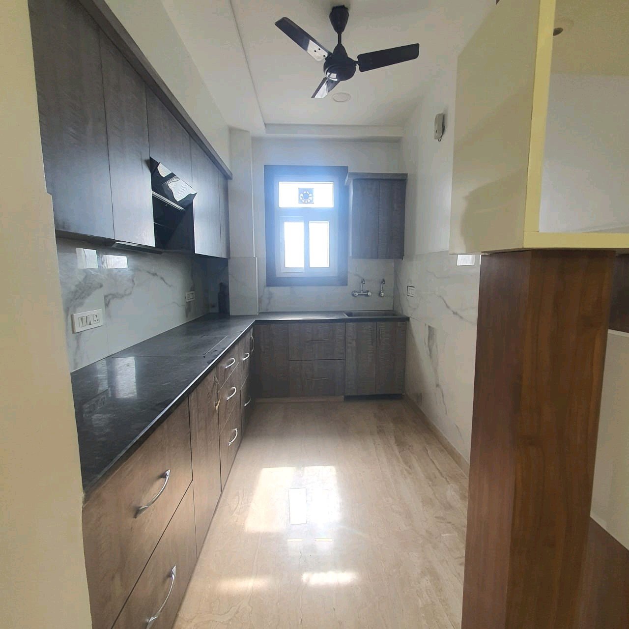 A well-designed 80 gaj top-floor builder floor in C4F Block Janakpuri with roof rights, 2 BHK + 1 room set, ACs fitted, chimney, and corner north-facing advantage.