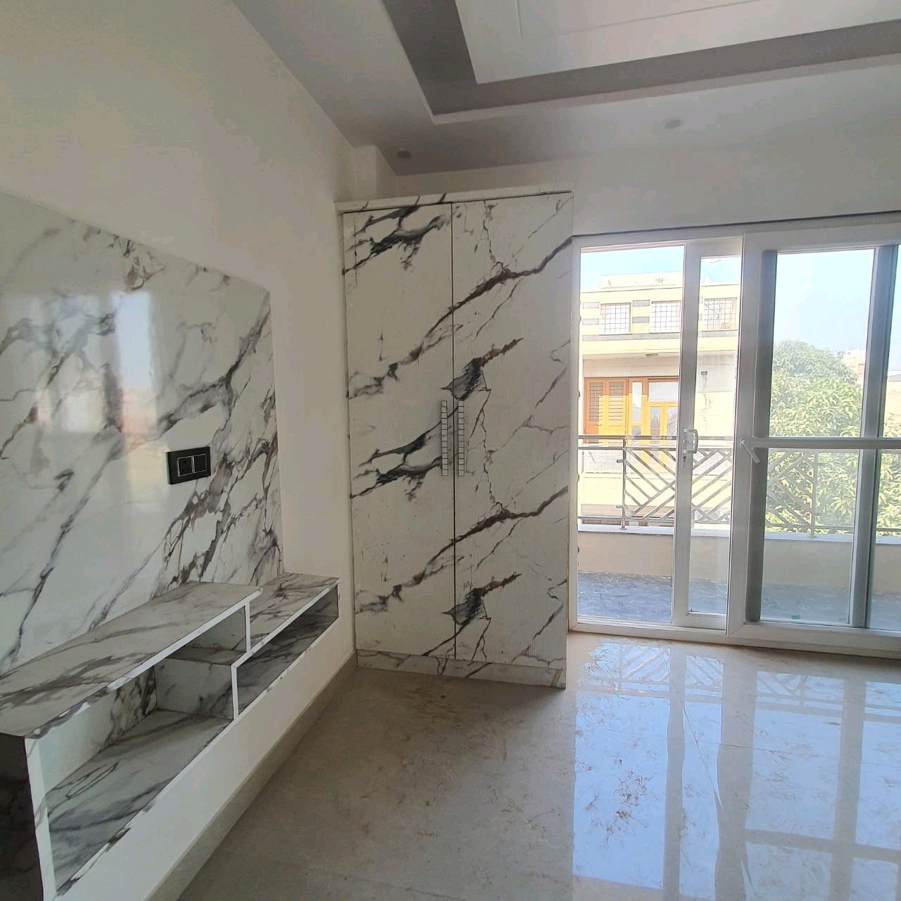 A newly constructed 2 BHK top-floor builder floor in C6B Block Janakpuri featuring 2 washrooms, a roof porta cabin, and an additional roof bathroom.